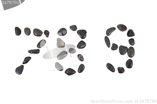 Image of stone alphabet from black stones