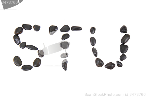 Image of stone alphabet from black stones