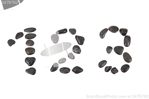 Image of stone alphabet from black stones