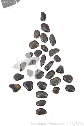 Image of christmas tree from black stones isolated