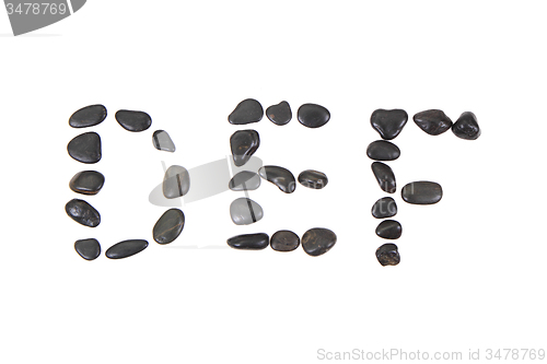 Image of stone alphabet from black stones