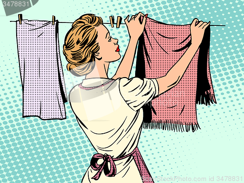 Image of woman hangs clothes after washing housewife housework comfort