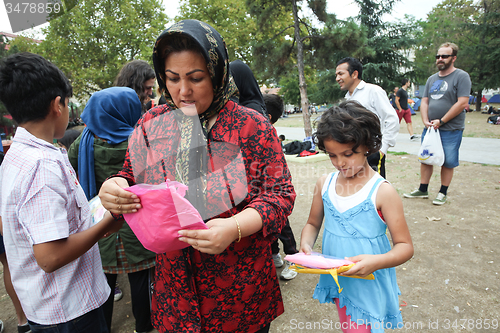 Image of Woman and child receiving help