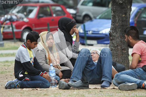 Image of Refugees resting on ground in Belgrade