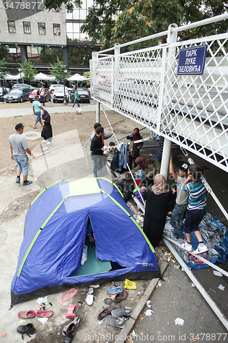 Image of Syrian refugees in the parking lot