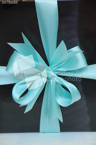 Image of Gift box with blue ribbon
