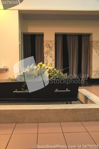 Image of Funeral flowers on a casket