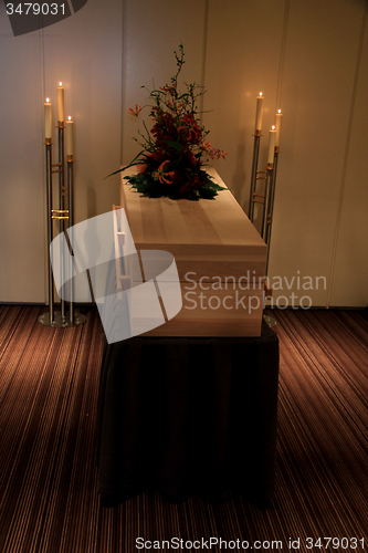 Image of Wooden casket in funeral home