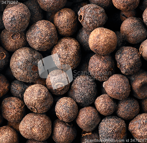 Image of black aromatic peppercorns background