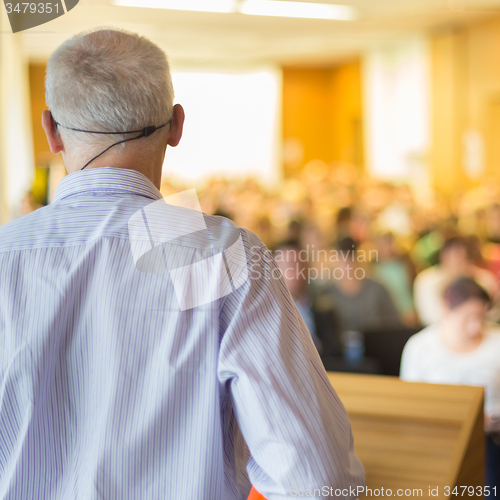 Image of Speaker at Business Conference and Presentation.