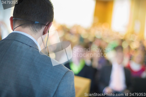 Image of Speaker at Business Conference and Presentation.