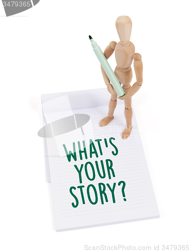 Image of Wooden mannequin writing - What\'s your story