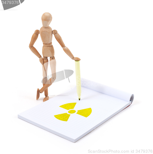 Image of Wooden mannequin writing - Radioactive