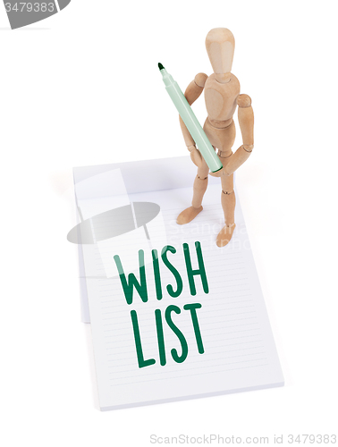 Image of Wooden mannequin writing - Wish list