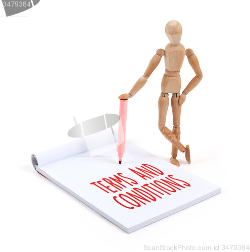 Image of Wooden mannequin writing - Terms and conditions