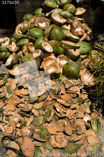 Image of empty shels of fresh coconuts in the market