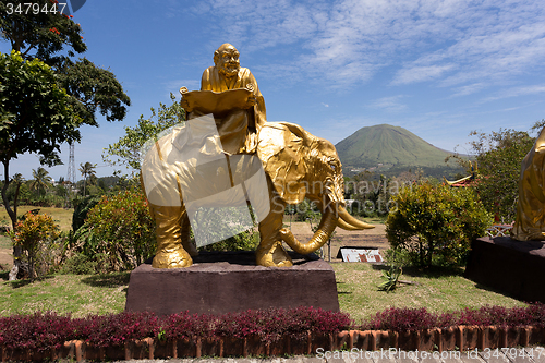 Image of fat monk on elephant statue in complex Pagoda Ekayana