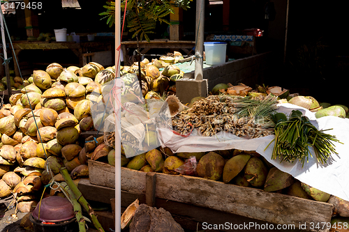 Image of empty shels of fresh coconuts in the market