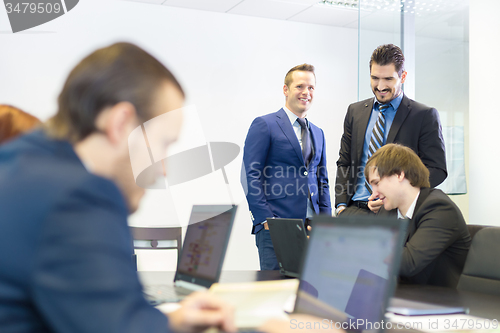 Image of Business people in modern office.