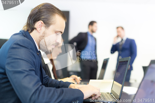 Image of Business people in modern office.