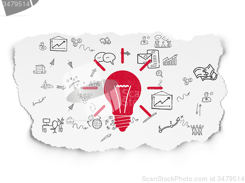 Image of Finance concept: Light Bulb on Torn Paper background