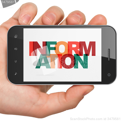 Image of Information concept: Hand Holding Smartphone with Information on  display