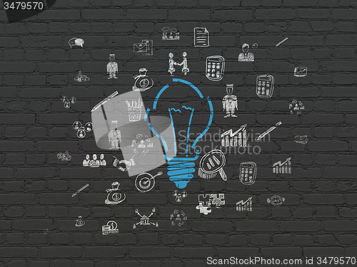 Image of Finance concept: Light Bulb on wall background