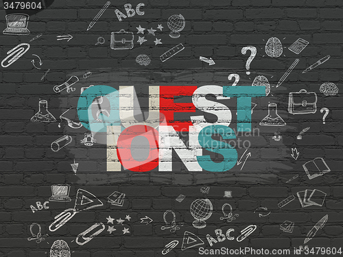 Image of Learning concept: Questions? on wall background