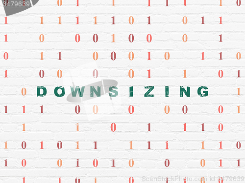 Image of Finance concept: Downsizing on wall background