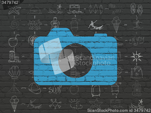 Image of Vacation concept: Photo Camera on wall background