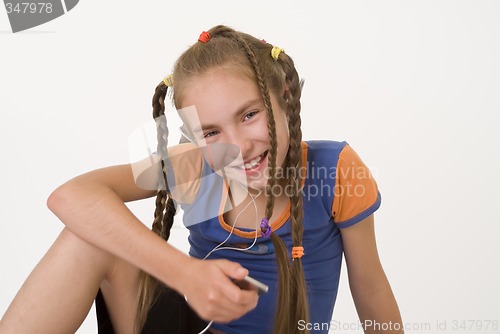 Image of Girl with a mediaplayer II