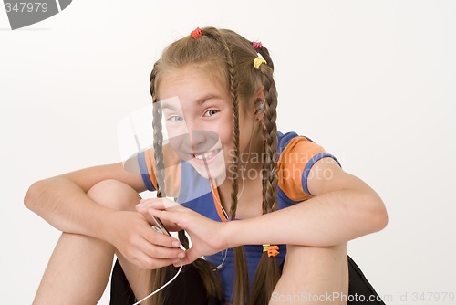 Image of Girl with a mediaplayer III