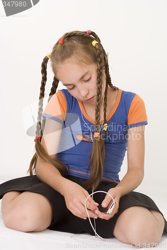 Image of Girl with a mediaplayer IV