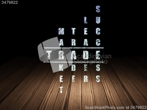 Image of Finance concept: word Trade in solving Crossword Puzzle