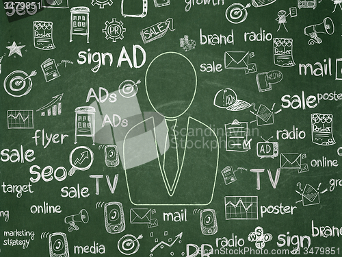 Image of Advertising concept: Business Man on School Board background
