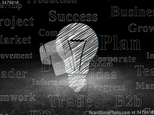Image of Business concept: Light Bulb in grunge dark room