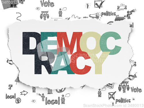 Image of Political concept: Democracy on Torn Paper background