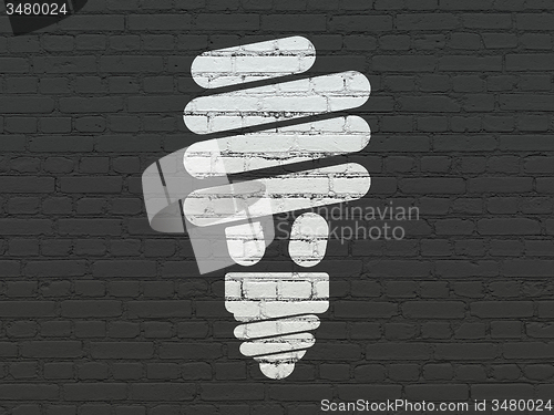 Image of Finance concept: Energy Saving Lamp on wall background