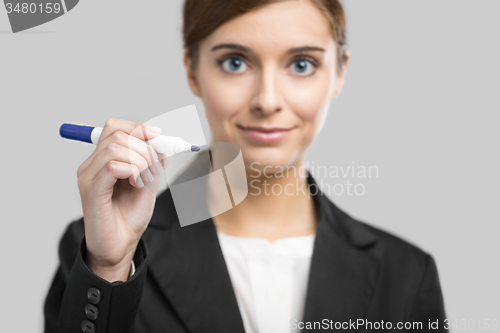 Image of Businesswoman drawing on a glass board