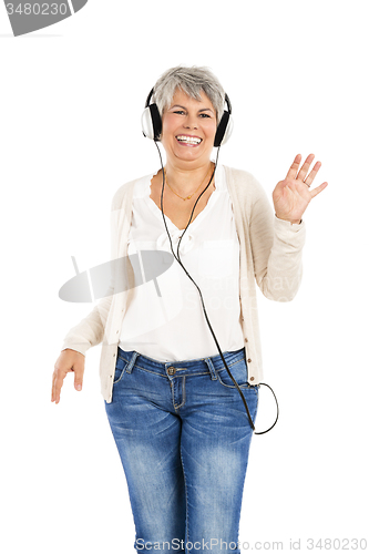 Image of Elderly woman listen music