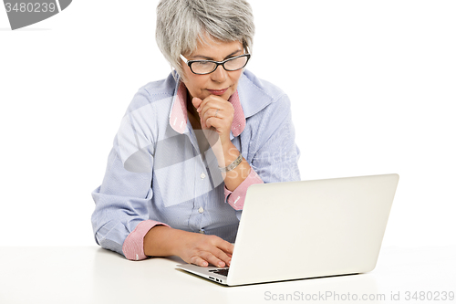 Image of Ellderly woman working with a laptop