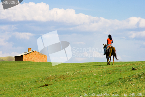 Image of Girl Ridding Horse