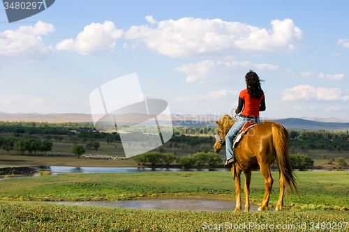 Image of Girl Ridding Horse