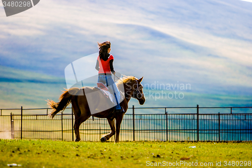 Image of Girl Ridding Horse