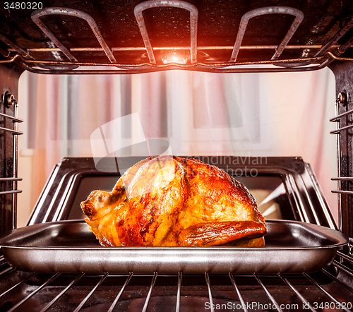 Image of Roast chicken in the oven.