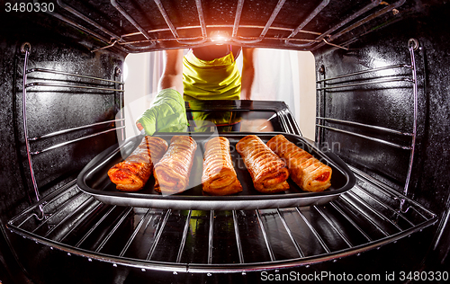 Image of Cooking in the oven at home.