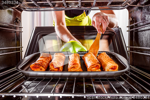 Image of Cooking in the oven at home.