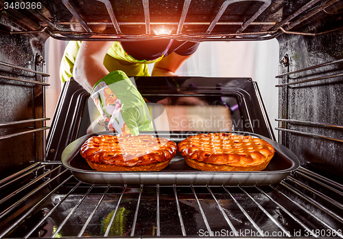 Image of Cooking in the oven at home.