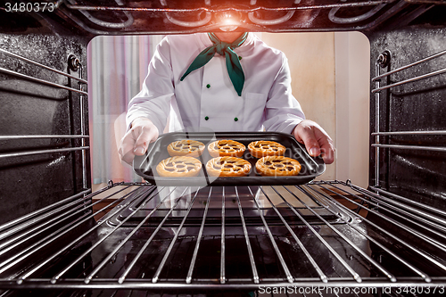 Image of Chef cooking in the oven.