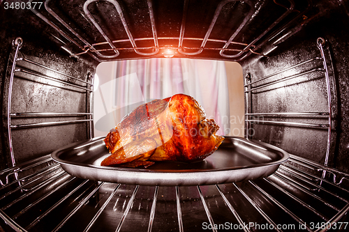 Image of Roast chicken in the oven.